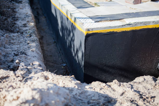 Professional Waterproofing technician working in Plainview, NY